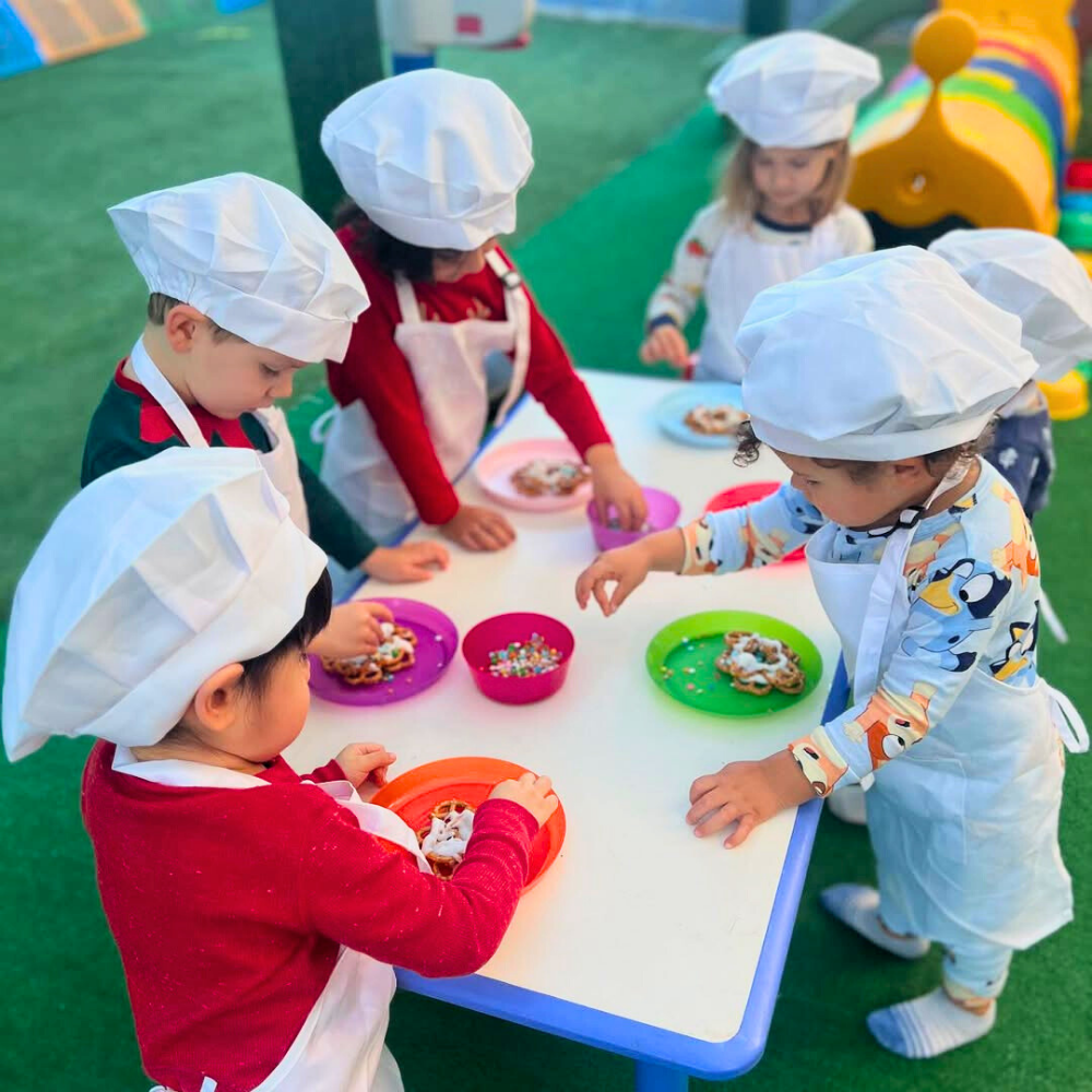 Children cooking with colorful plates.
